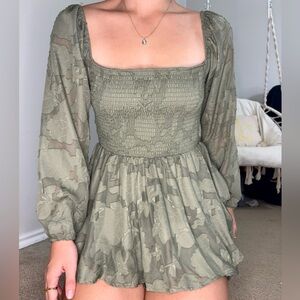 Green long sleeve dress with built-in shorts and mesh sleeves